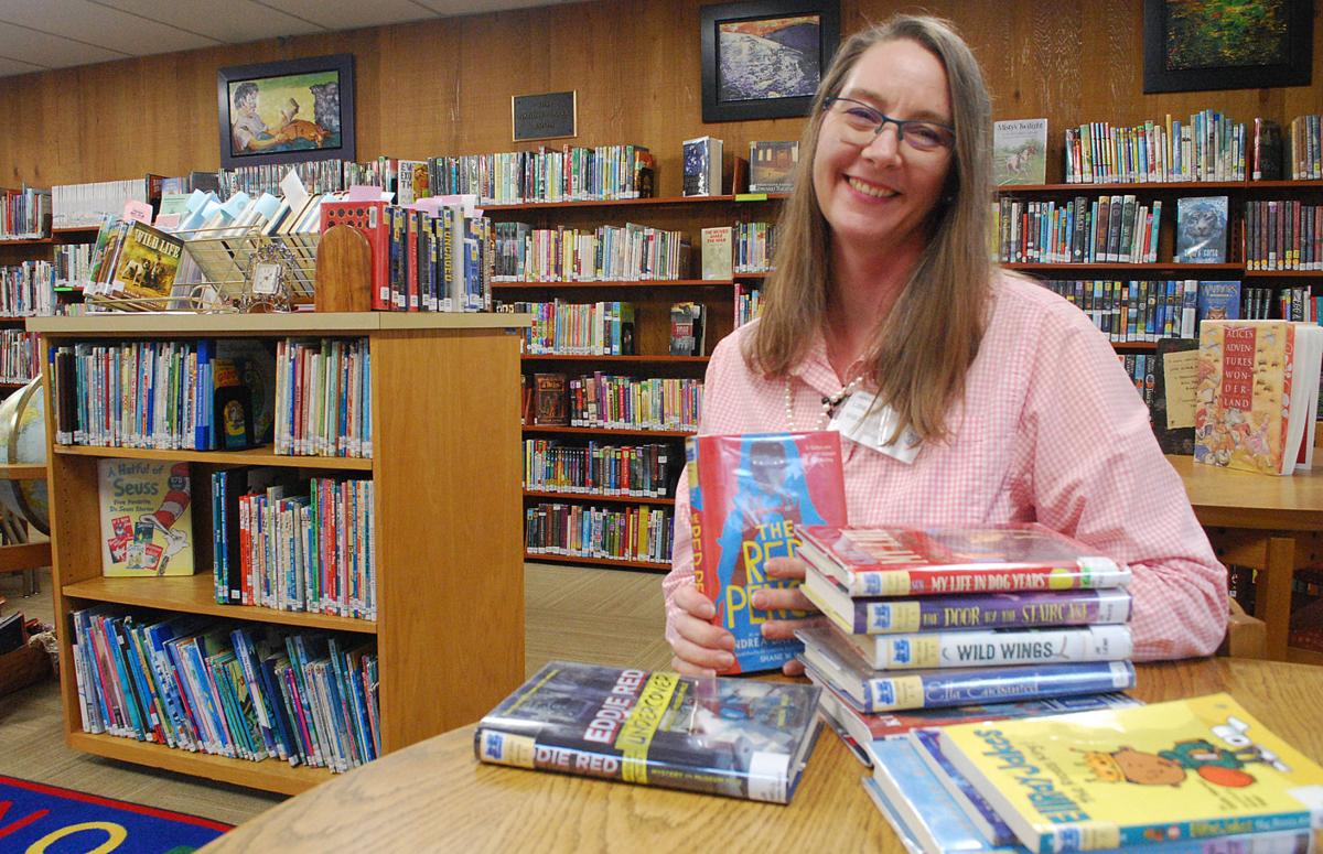 Lyrical librarian adds musical mirth to city report News