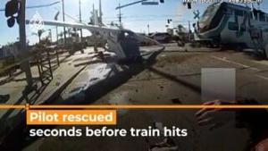 Pilot of crashed plane rescued seconds before train hits