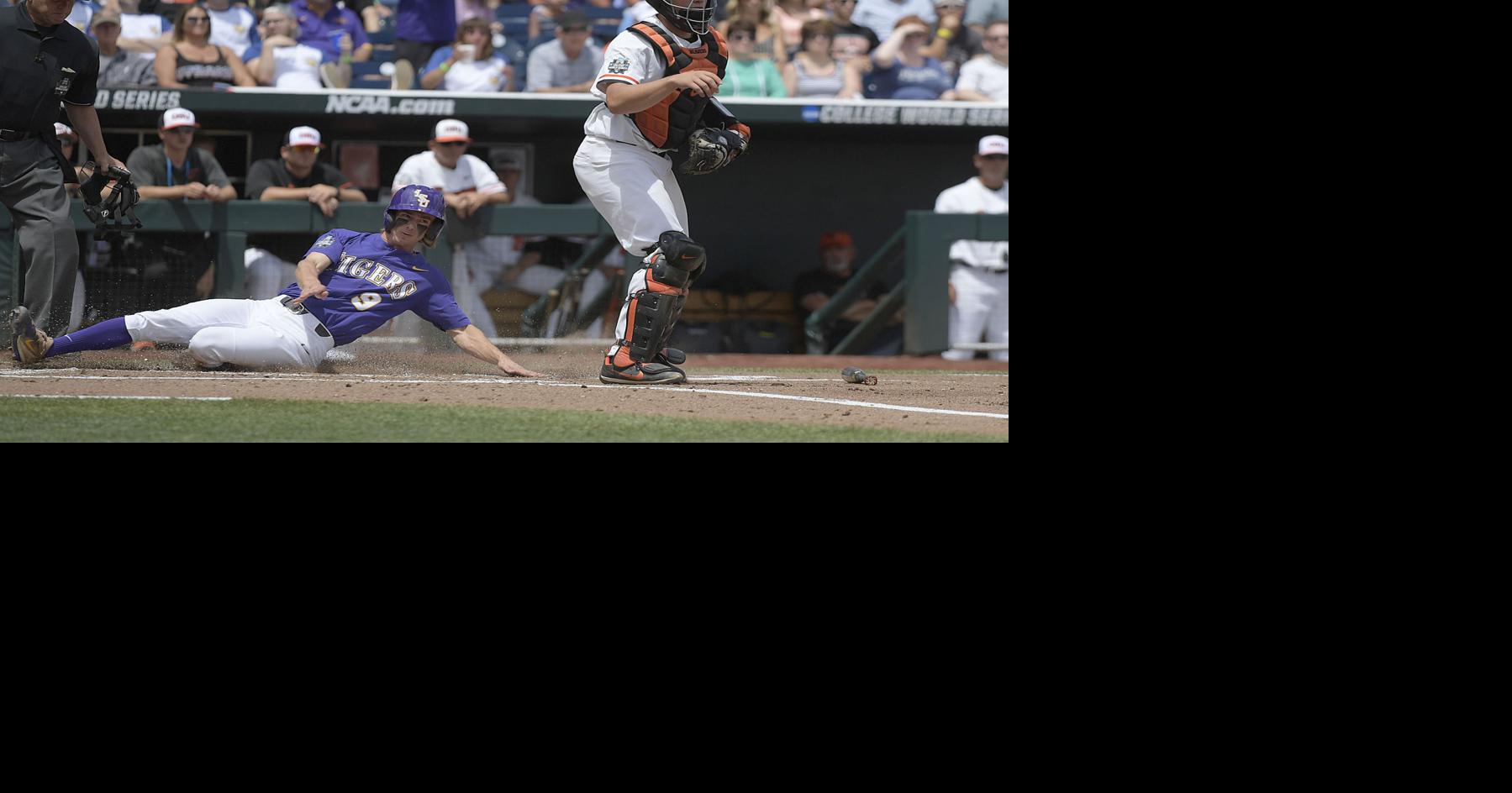 Oregon State's Steven Kwan, left and Adley Rutschman sit on top of