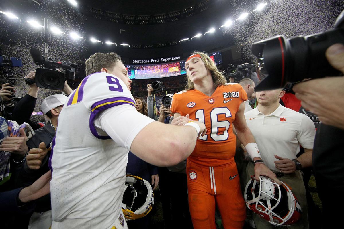 Louisiana State quarterback Joe Burrow (9) talks with Clemson quarterback Trevor Lawrence (16) after LSU's 42-25 victory in the College Football Playoff National Championship game at Mercedes Benz Superdome in New Orleans on Jan. 13, 2020.