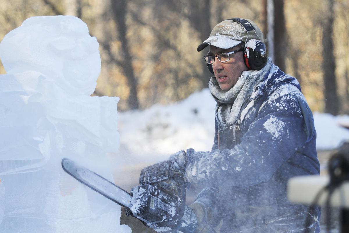 David Soha of Ice Breakers carves out a Star Wars theme Ice Sculpture during the 17th annual Frost Festival activities at Alexander Carr Park.