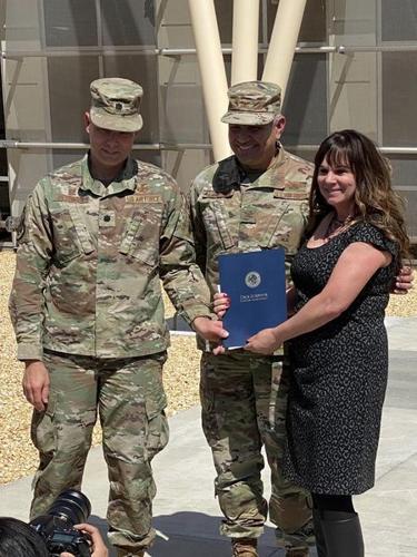 KC 2nd Dist. Supervisor field rep Laura Lynne Wyatt presents a Certificate of Recognition to the 445 Test Squadron on behalf of Supervisor Scriv.jpg
