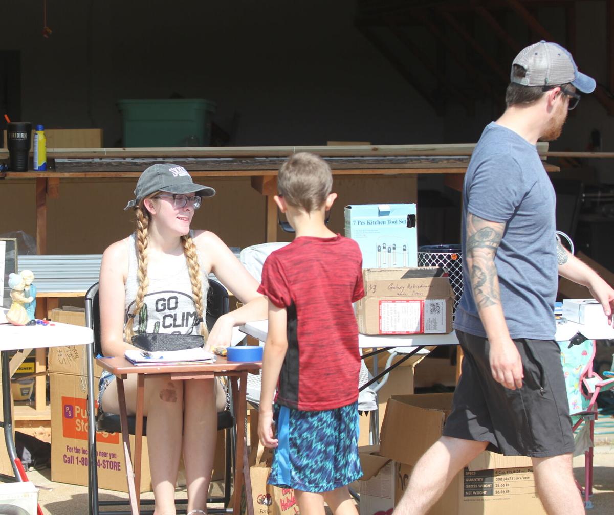 Garage Sale lady kid and dad.jpg