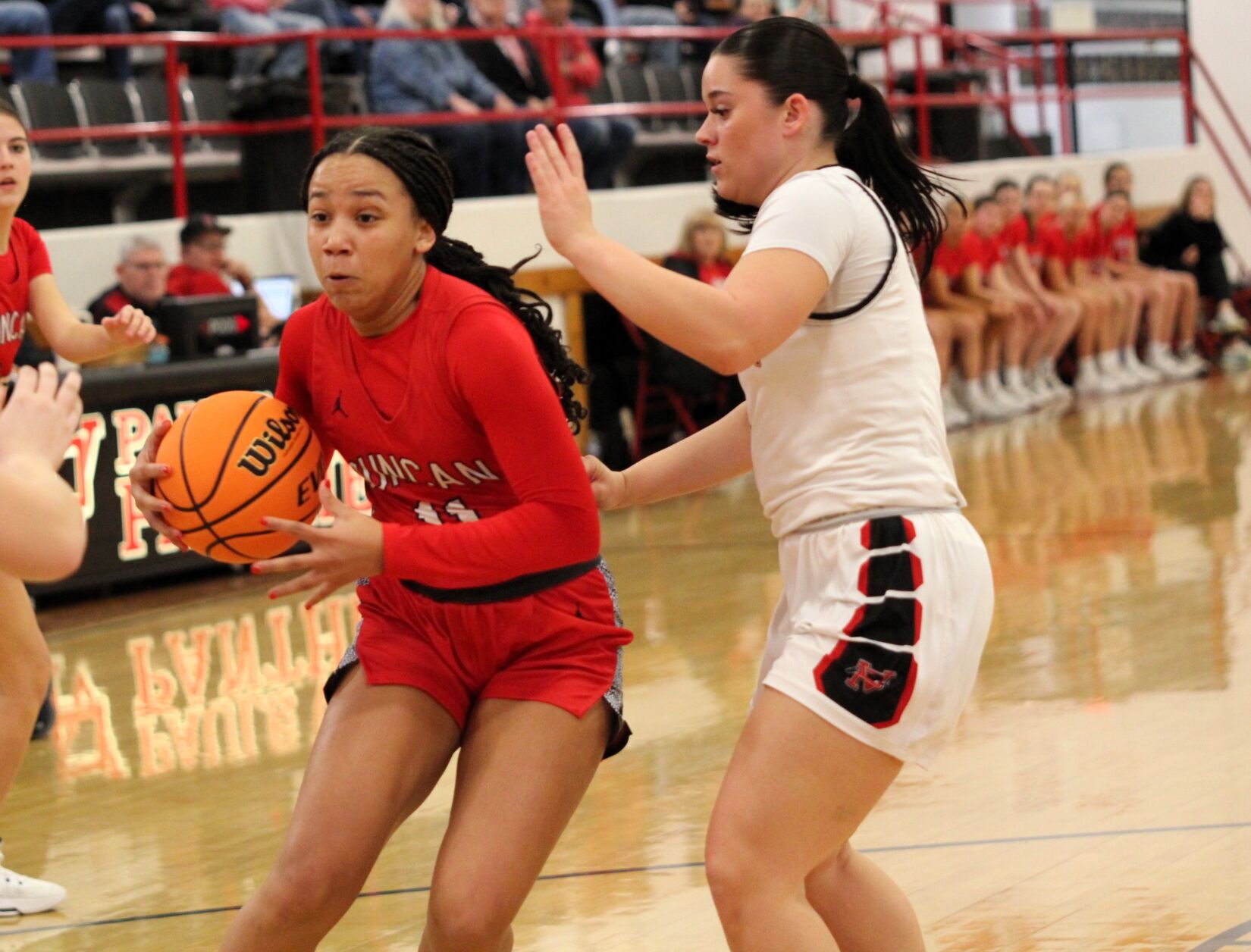 Lady Demons Secure Playoff Victory and Surpass 20-Win Season Milestone with Stellar Defense