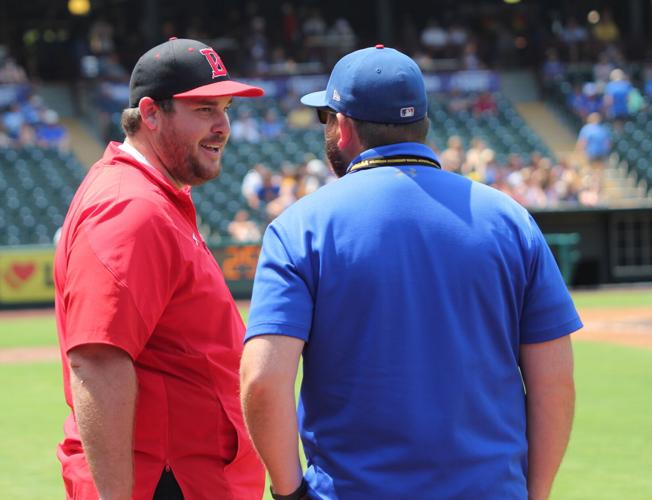 Coach Oliver talks with staff.jpg