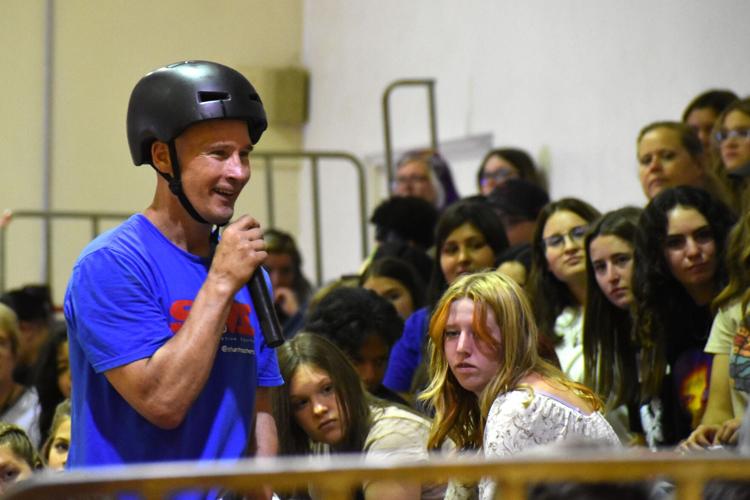 Highflying bike act helps launch library's special programming for the