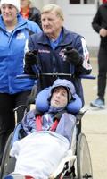 Rick Hoyt, who became a Boston Marathon fixture with father pushing wheelchair, has died at 61
