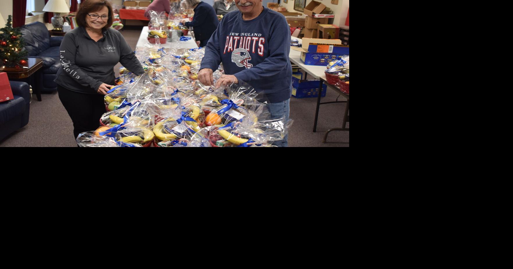 Volunteers with AHEPA 39 assemble food baskets for the elderly News