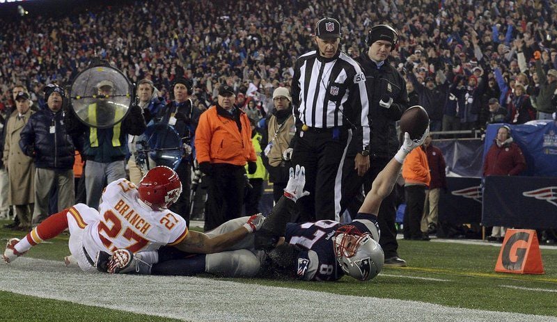 New England Patriots tight end Rob Gronkowski (87) runs from Cincinnati  Bengals defenders after catching a pass during the second half of an NFL  football game, Sunday, Oct. 16, 2016, in Foxborough