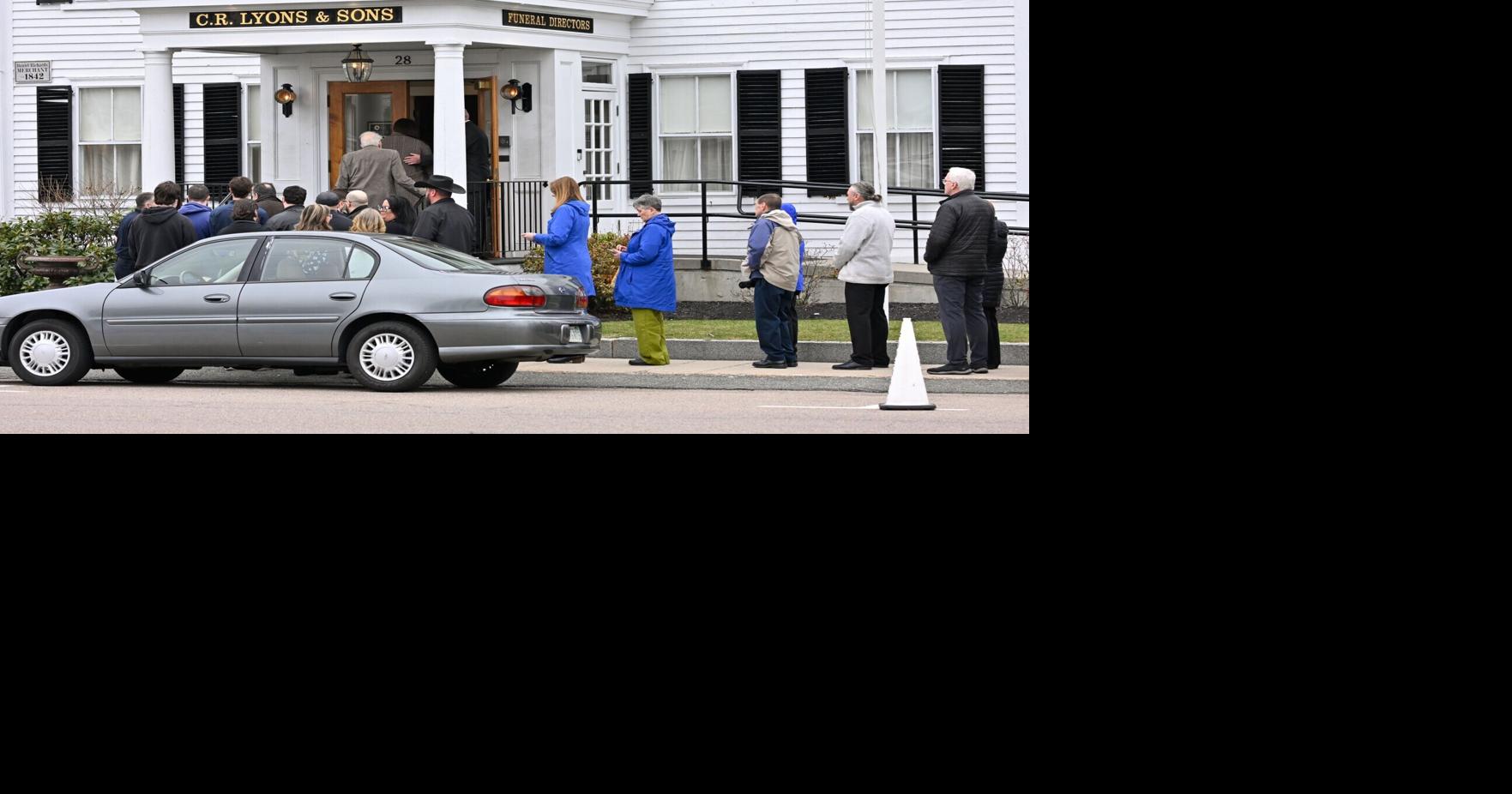 Hundreds wait in cold, rain to say goodbye to slain mother, nurse