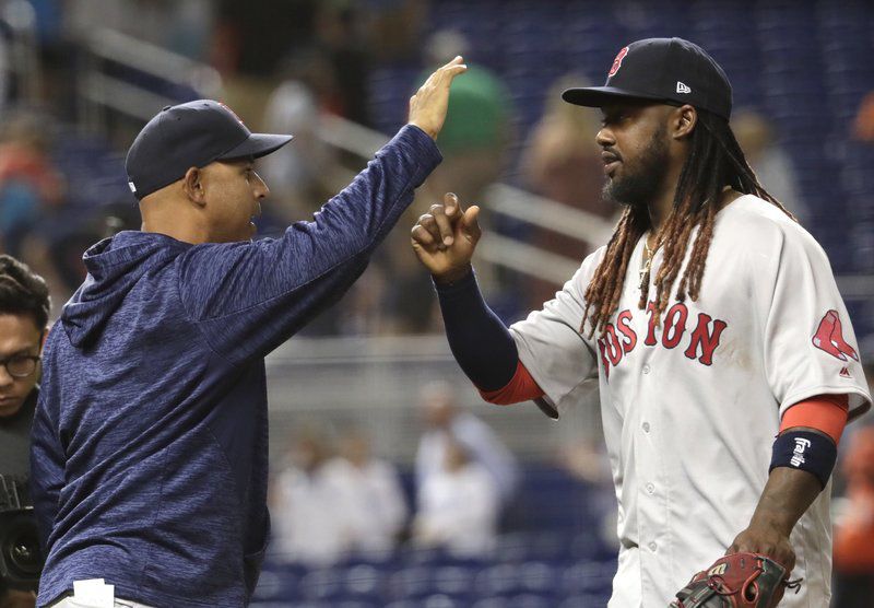 Boston Red Sox shortstop Hanley Ramirez carries his daughter