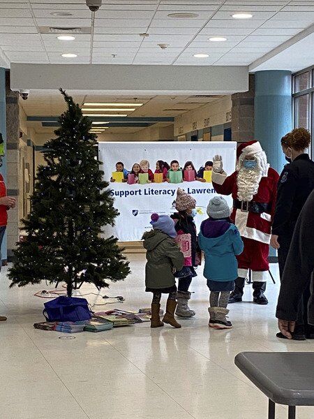 Santa helps Lawrence teachers give books, school supplies to needy students