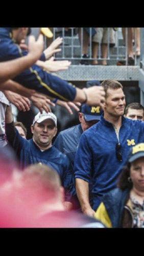 Tom Brady does a cool gesture for his former high school