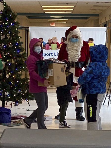 Santa helps Lawrence teachers give books, school supplies to needy students