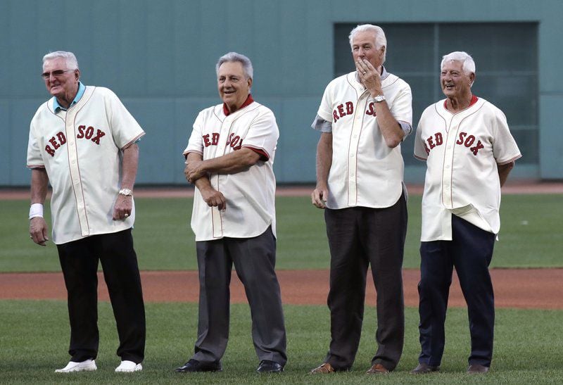 Luis Tiant, Boston Red Sox pitcher, escorts his wife, Maria, from