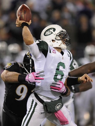 New York Jets quarterback Mark Sanchez (6) scrambles against the