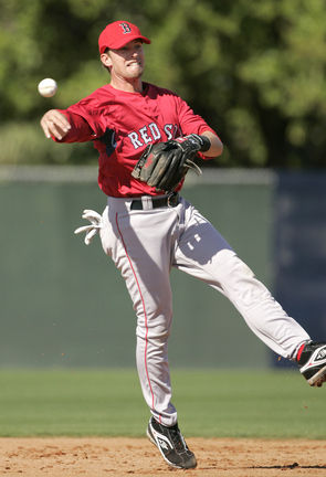 Boston Red Sox shortstop Julio Lugo throws to first baseman Kevin