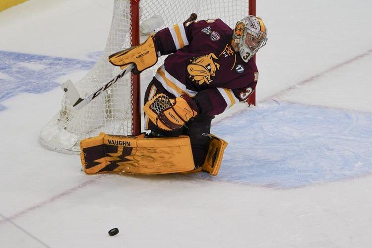 FROZEN FOUR UMass hockey tops twotime defending champs in OT Local