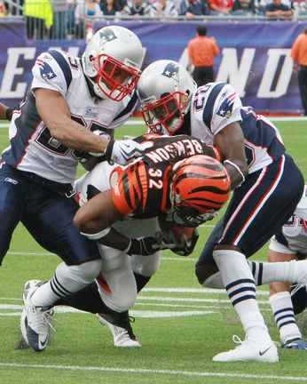 New England Patriots rookie tight end Rob Gronkowski grabs his first NFL  touchdown catch, next to Cincinnati Bengals linebacker Dhani Jones, during  the second half of New England's 38-24 win in an