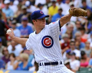 Harden pitches Cubs past Cincinnati, back into first place