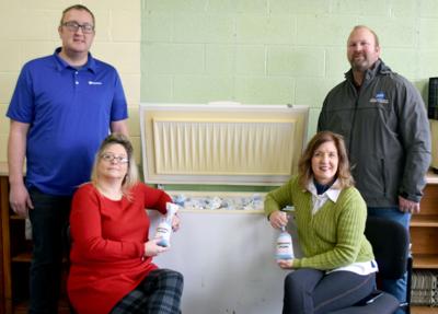 Business, group supply area food pantries with pork