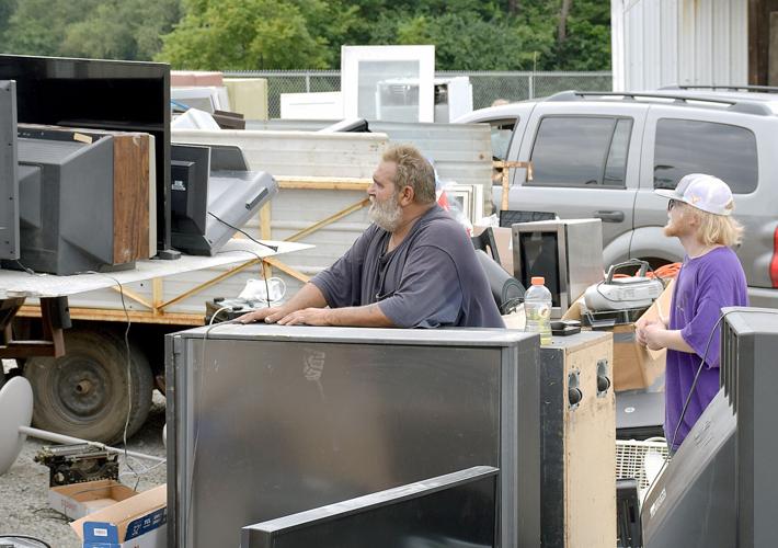 Local volunteers turn unwanted junk into Church donations - Fred Honaker and Hunter Hargis