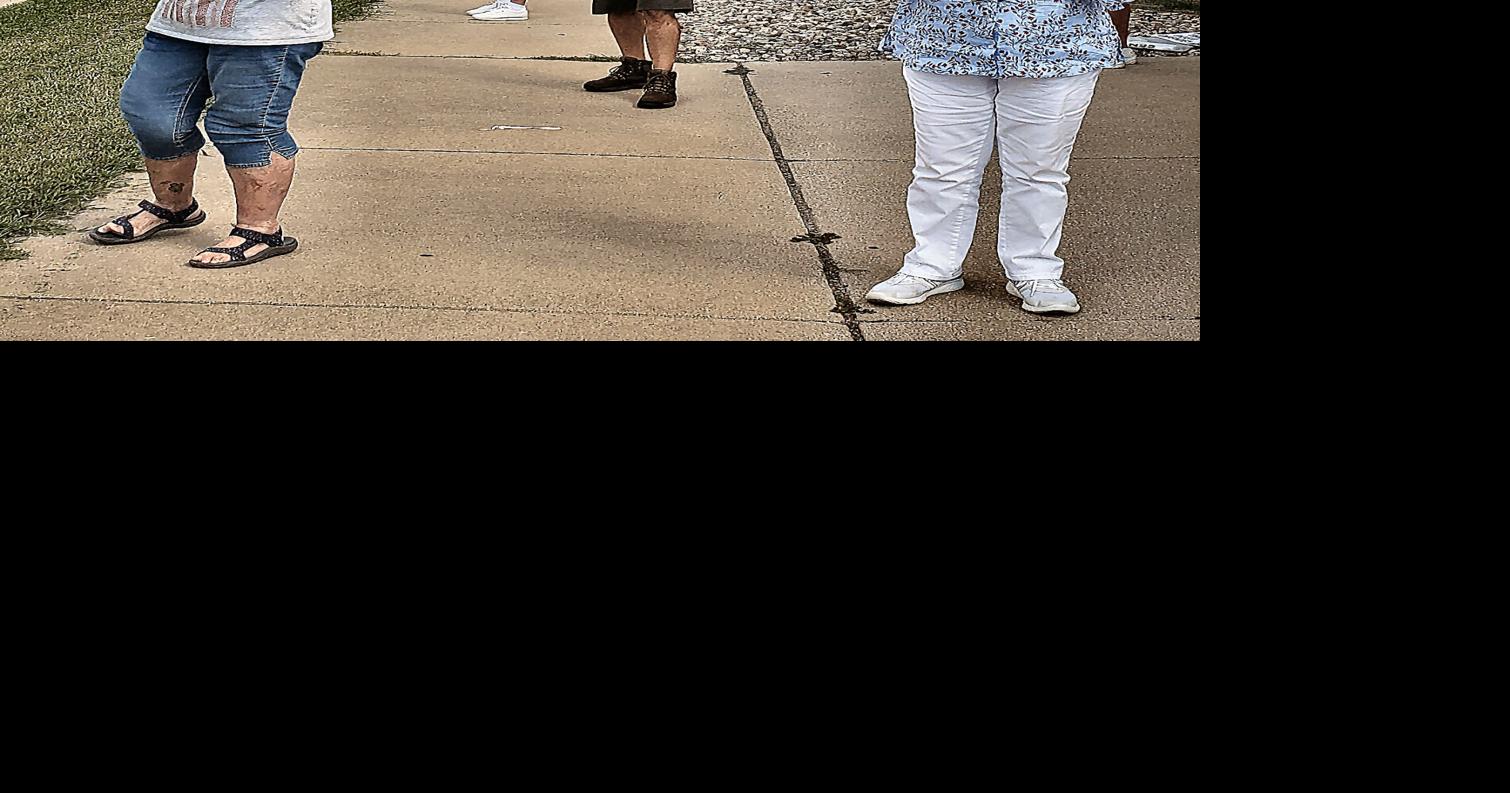 Demonstrators outside Effingham post office call service vital Local