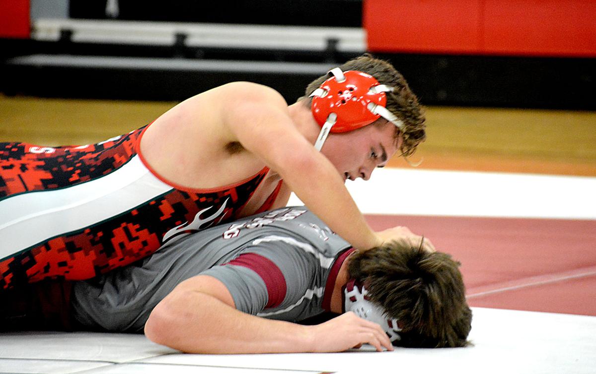 WRESTLING Flaming Hearts rise up, pin down Sports