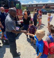 Firefighters give away 300 backpacks
