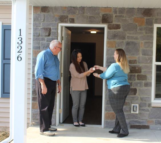 Two families receive keys to new homes2a