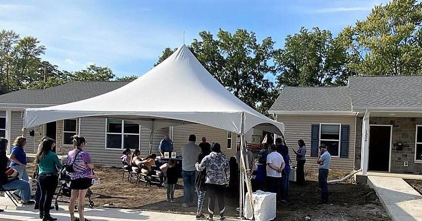 Two families receive keys to new homes1