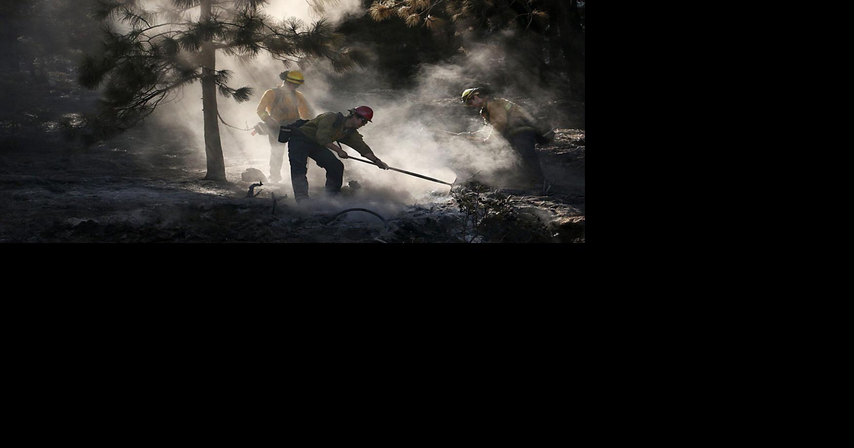 Firefighters work to put out a hot spot and contain the Davis Fire alongside the Mt. Rose Hwy on Sept. 12, 2024.