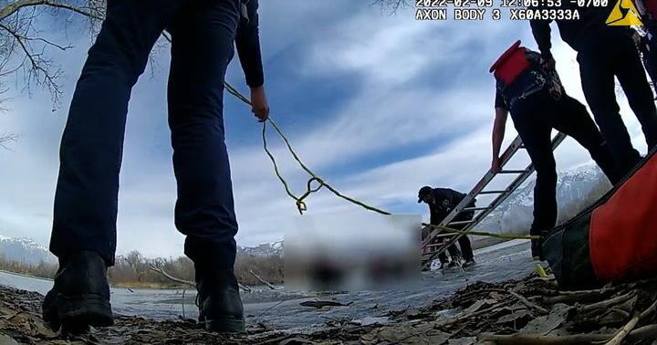 Police Officer Rescuing Utah police officers fall in icy pond rescuing teen
