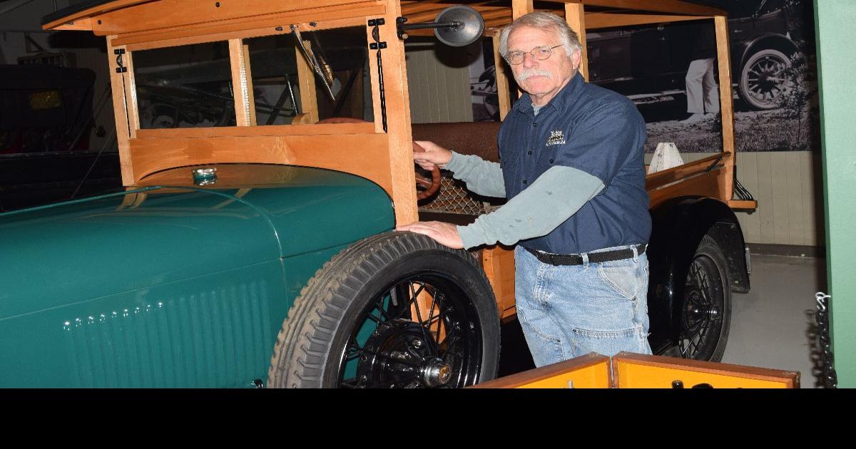 Seal Cove museum mechanic driving in Great Race Arts & Living
