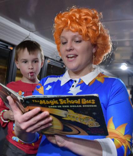 Ms. Frizzle (Meagan Hays) reads at Family Reading Night