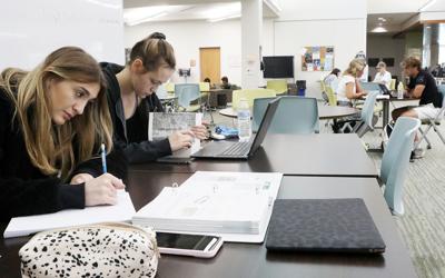 East Central College students study in library