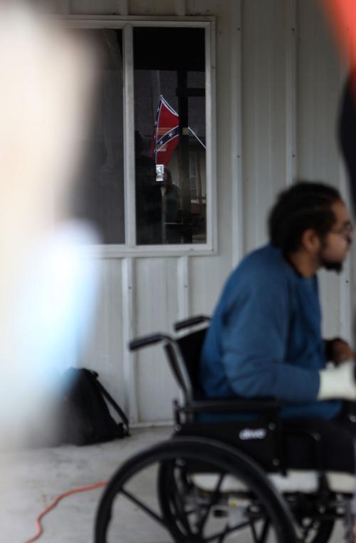a confederate flag is reflected in a window