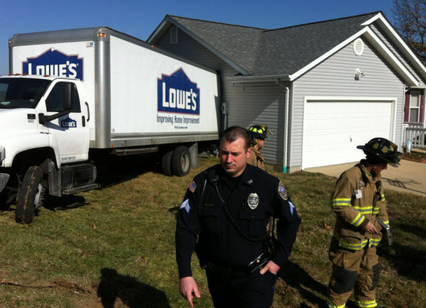 Truck Crashes into House