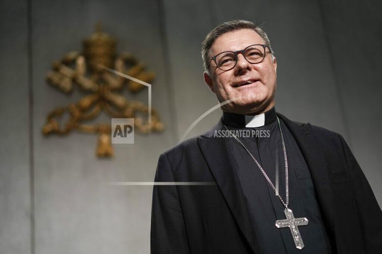 New Cardinal Giorgio Marengo receives the red three-cornered biretta hat  from Pope Francis during a consistory inside St. Peter's Basilica, at the  Vatican, Saturday, Aug. 27, 2022. Pope Francis has chosen 20