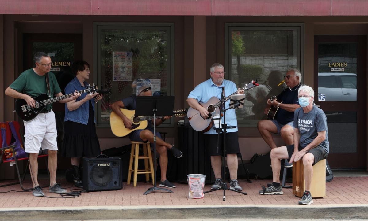 Musicians play in front of the Farmer's Market
