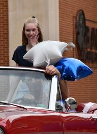 Emily Elfrink wipes away a tear