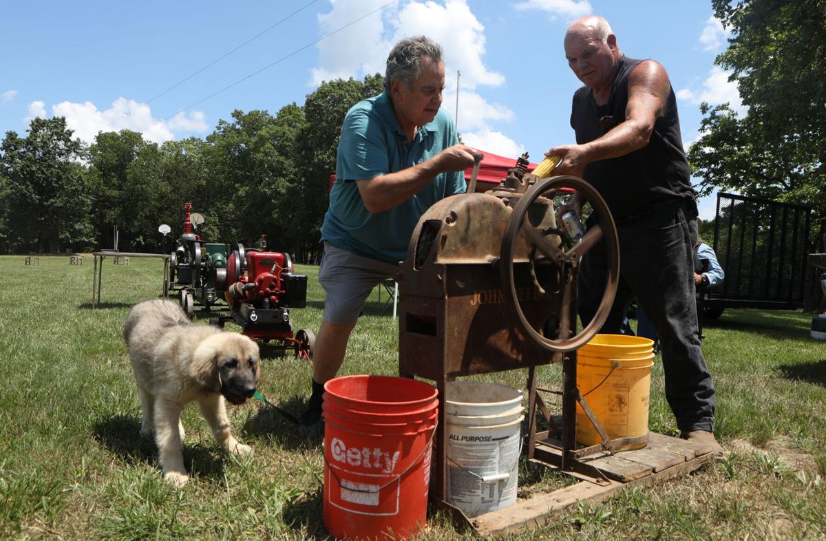 Dan Stuertz and Dave Schulte run antique corn sheller