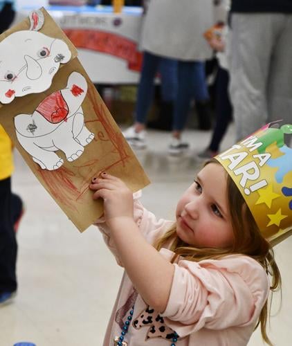 Elliot Gough makes puppet at Family Reading Night