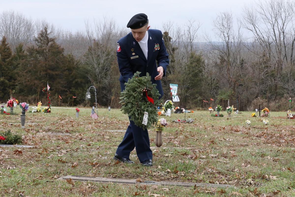 Jack Luxton lays a wreath down