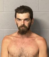 Man faces multiple charges after firing weapon at residence