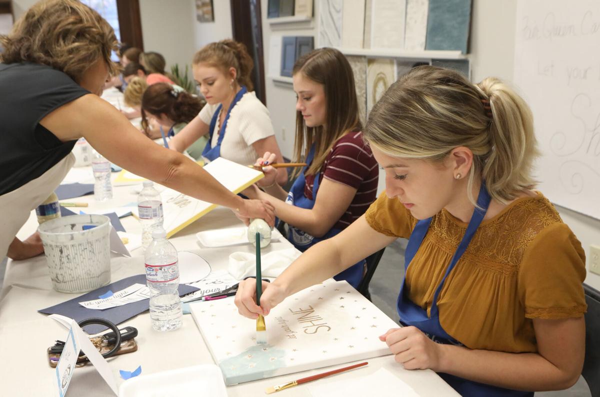 Nikole, Belle and Kayla paint