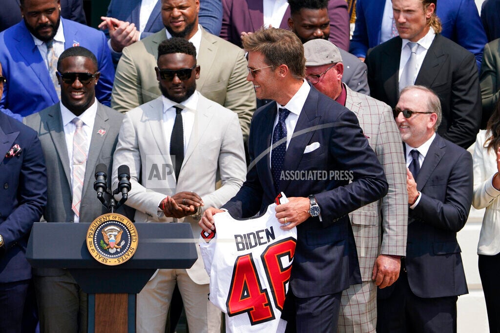 Washington, United States. 20th July, 2021. U.S. President Joe Biden, holds  a number 46 jersey handed to him by Super Bowl Champions Tampa Bay  Buccaneers owner Bryan Glazer, on the South Lawn