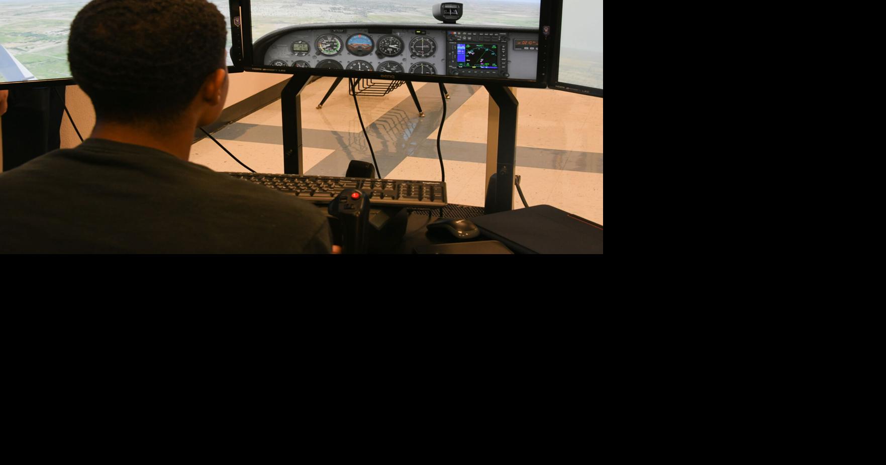 Altus pilots educate aspiring Airmen in flight simulator program