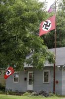 Hunter woman sues man who shot her for stealing Nazi flag