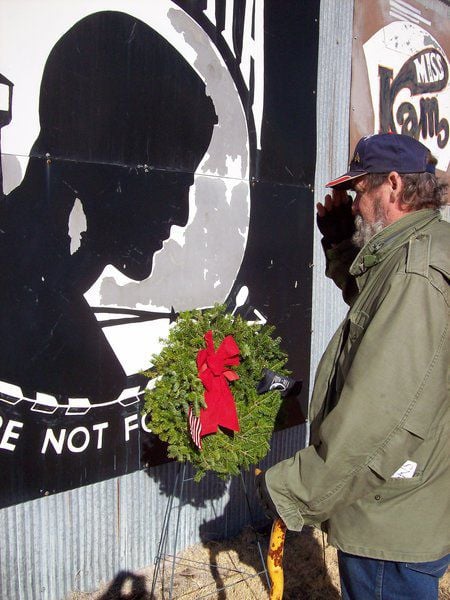 Woodring Wall of Honor offering wreaths to honor veterans' graves